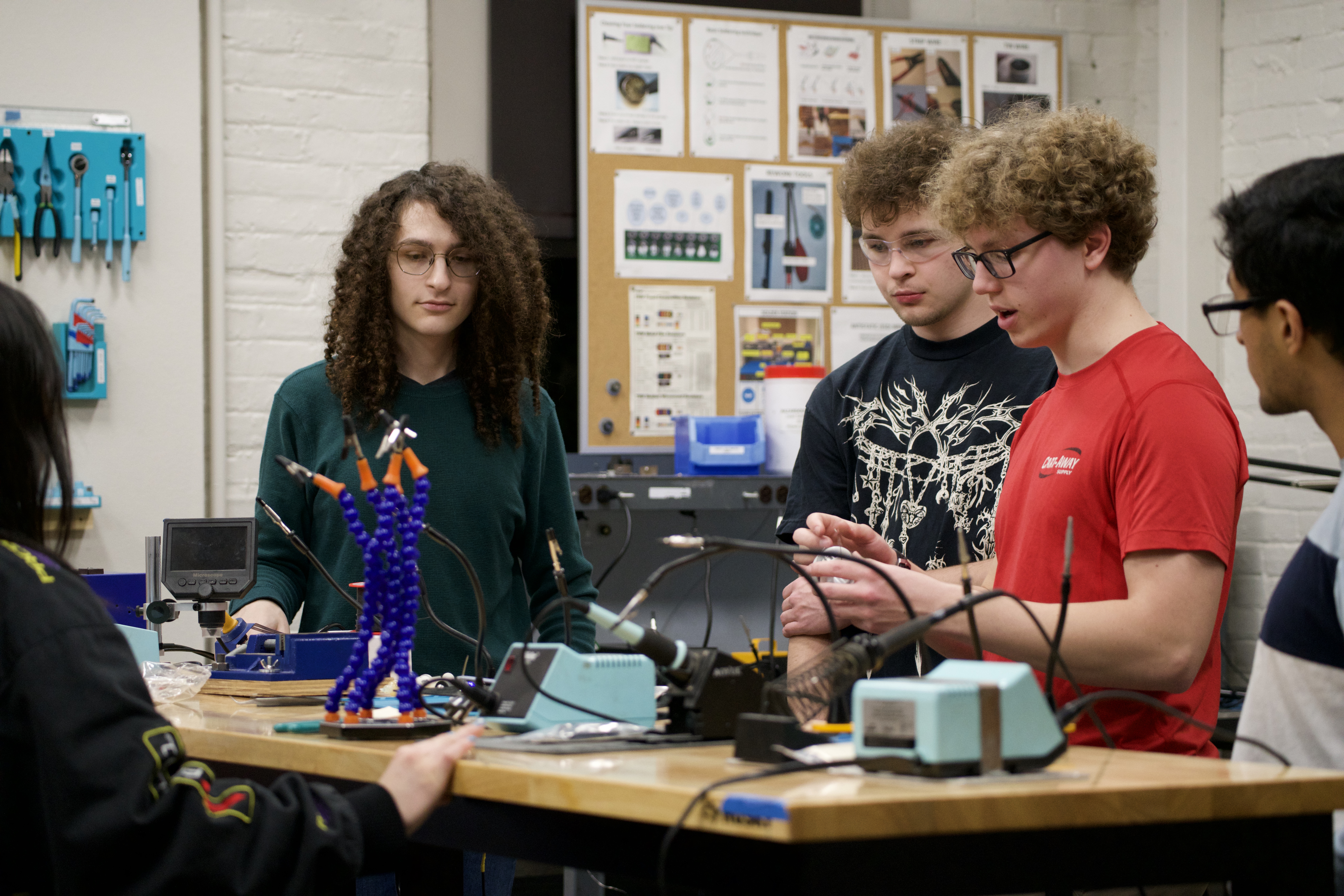 Workshop leader explaining a hardware topic