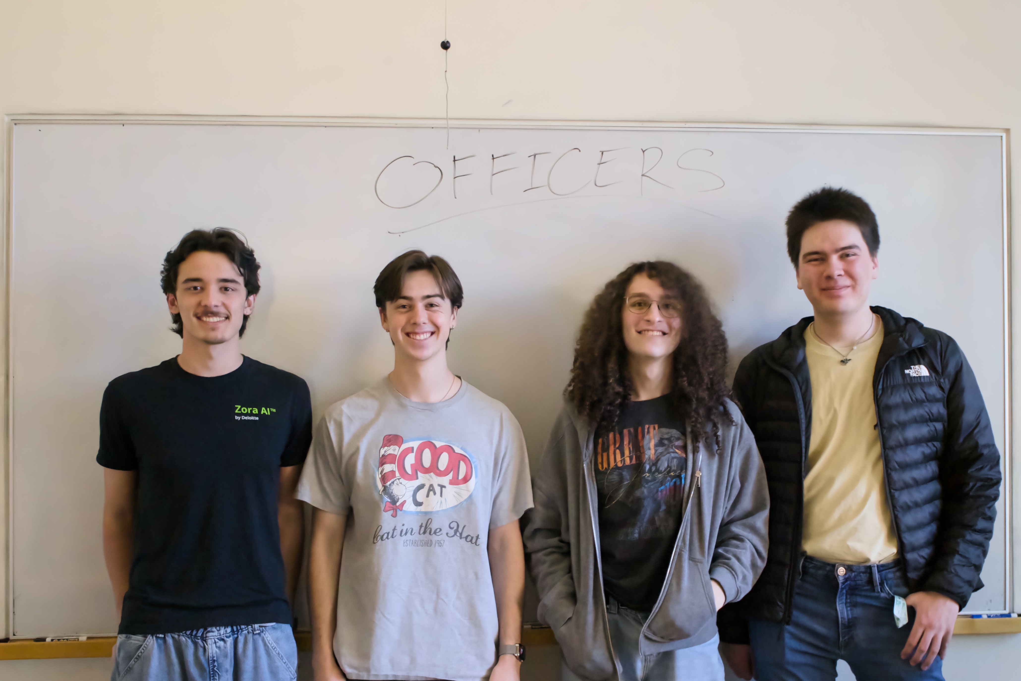 The officer team in front of a whiteboard